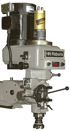 A left side view of the HH Roberts 7 1/2 Hp milling machine head with a face mill.